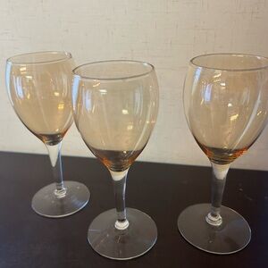 3 Amber / iridescent colored cordial glasses.